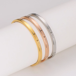 Three-piece stainless steel Love Kiss bangles in gold, rose gold and silver matte finish