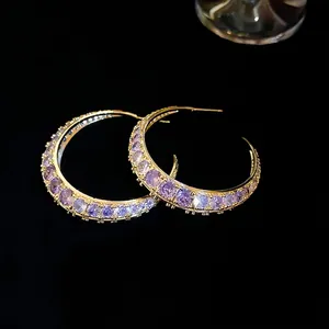 Chic gold-plated crescent hoop earrings with pavé set light purple zircon stones