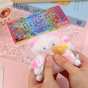 Cute white cat squishy toy from Pinch Family in clear packaging for stress relief