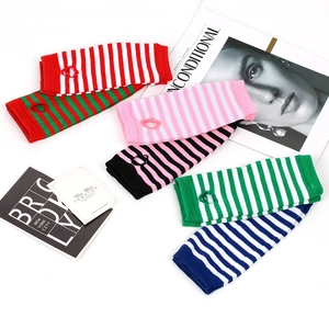 Colorful striped knitted fingerless arm warmers in various color combinations