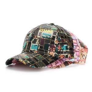 Close-up of three sequined baseball caps in black, pink and gold with geometric patterns