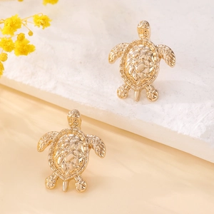 Golden sea turtle stud earrings for women with detailed shell texture and polished finish