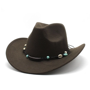 Detail of dark brown wool felt cowboy hat with shell and turquoise bead decoration