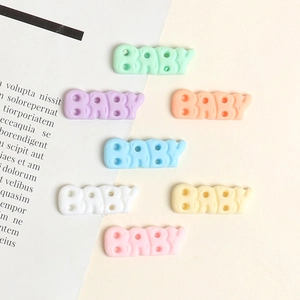 Detailed view of resin BABY letter charms in seven assorted pastel colors for DIY crafts