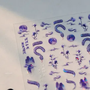 Macro detail of aurora snake and floral nail stickers with holographic purple finish