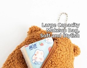 Detailed view of brown plush coin purse showing zipper and spacious inner storage space