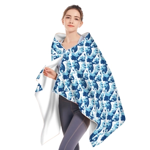 Detail of hooded microfiber beach towel featuring blue Great Wave off Kanagawa print