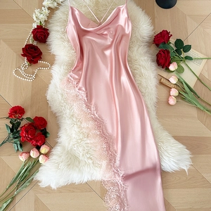 Pink satin slip dress with lace patchwork and cowl neck flat lay on plush rug