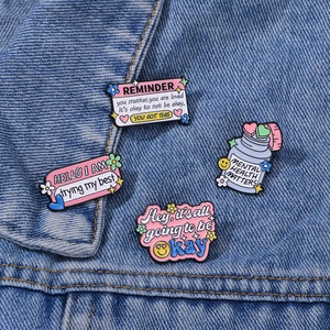 4-piece colorful enamel mental health pin set displayed on blue denim jacket