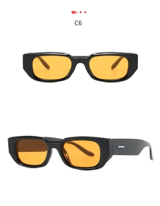 Close-up of C6 rectangle sunglasses featuring black thick frames and orange tinted lenses