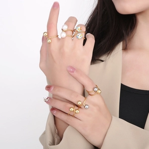 Irregular geometric stainless steel gold ring set with pearls and rhinestones on model