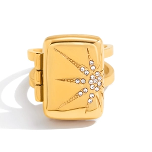 Detailed close-up of a 18K gold-plated locket ring featuring a sparkling starburst design