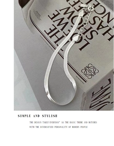 Close-up of S925 sterling silver flat snake bone chain bracelet with lobster clasp