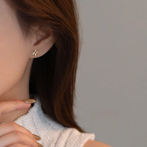 Elegant S925 sterling silver gold North Star stud earrings with white cubic zirconia