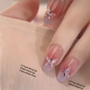 Sparkling butterfly zircon nail art gems with marquise and teardrop shapes on nails