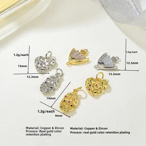 Macro detail of copper zircon heart and fan-shaped jewelry pendants with dimensions