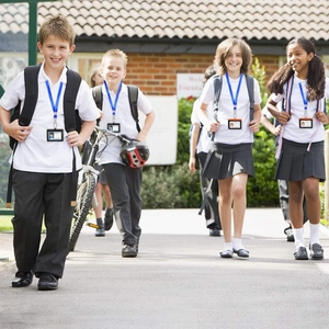Outdoor shot of students wearing durable ID card holders with fabric neck lanyards