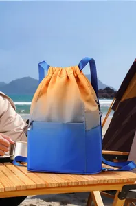 Close-up of waterproof drawstring backpack with gradient design on a wooden camping table