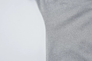 Detailed view of the fine stitching and grey knit fabric on the summer button dress