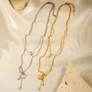 Double-layered butterfly pendant necklace set in gold and silver finish with zircon accents