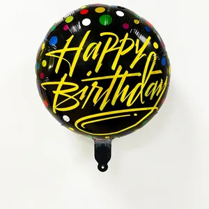 Close-up of 18 inch black round foil balloon with colorful dots and Happy Birthday text