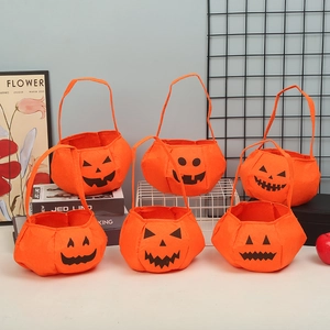 Set of 6 orange felt Halloween pumpkin bags with Jack-o'-lantern faces for candy