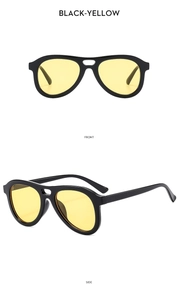 Macro view of aviator sunglasses with black frame and yellow lenses from front and side