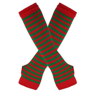 Close-up of red and green striped knit arm warmers with thumb holes on a plain background