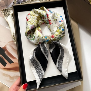 Floral and striped silk square scarf artfully tied inside a premium dark gift box