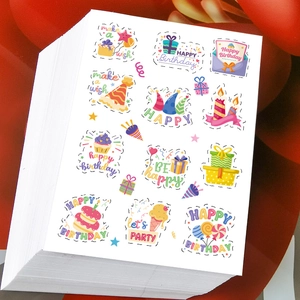 Stack of colorful birthday themed round stickers with cake and balloon patterns