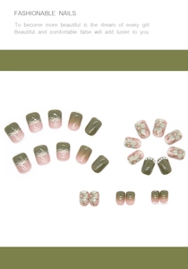 Detail of camellia press-on nails with green and pink gradients and pearl accents