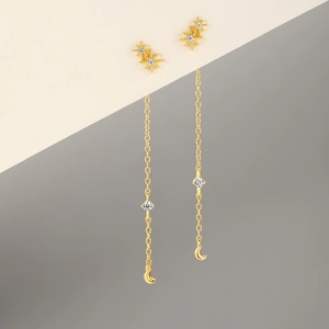 Detailed close-up of S925 silver gold tassels earrings with cubic zirconia star and moon