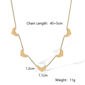 Detail view of gold flower geometric necklace showing 45+5cm length and 11g weight specs