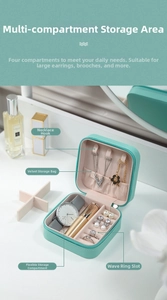 Detail view of mint green jewelry box with necklace hooks and rings compartments