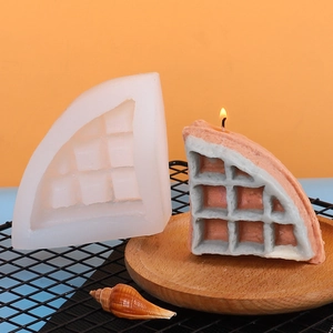 Detail showing translucent silicone waffle mold with finished two-tone scented candles