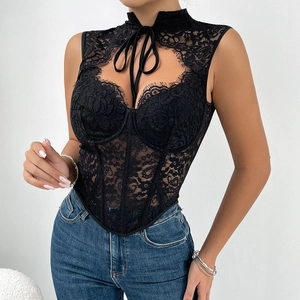 Close-up of black lace corset top with halter neck and sheer fishbone mesh details
