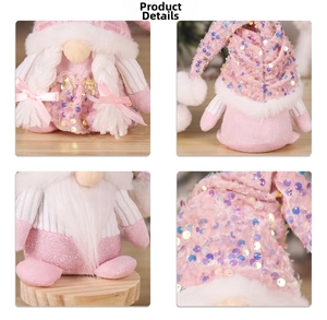 Close-up of pink gnome plush with sequined knit hat and soft faux fur beard details