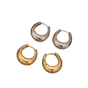 Minimalist U-shaped metal hoop earrings in polished gold and silver finishes