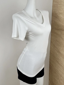 Side view of white slim-fit V-neck short sleeve T-shirt on mannequin with soft texture
