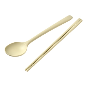 Minimalist beige silicone spoon and chopsticks set with non-slip texture on white background