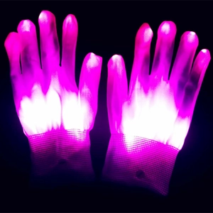 Detail of LED glowing gloves showing pink and purple lights in a dark environment