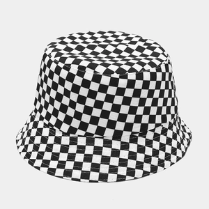 Detailed texture of black and white checkerboard pattern on cotton bucket hat fabric