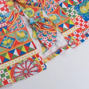 Detailed macro view of colorful Sicilian style prints and textile texture on the summer dress