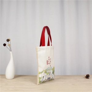 Detail of Friends TV Show canvas tote bag with red strap and colorful landscape print