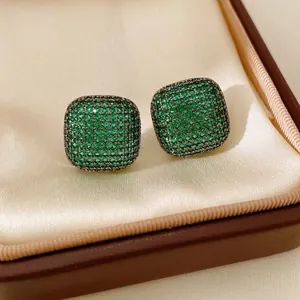 Vintage style square stud earrings featuring micro-paved green zircons in silver setting