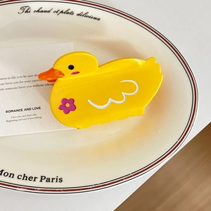 Pince à cheveux canard jaune mignon avec fleur mauve et motifs ondulés blancs