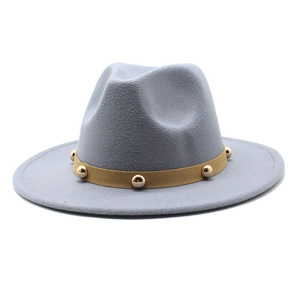 Detail of gray wool felt fedora featuring a khaki band with gold metal rivets