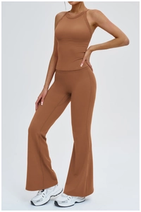 Detail of cross-back yoga vest and flared leggings in caramel brown athletic fabric
