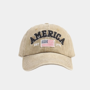 Close-up of vintage washed cotton baseball cap with American flag embroidery