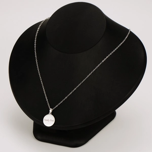 Polished silver stainless steel necklace with engraved Family First round pendant